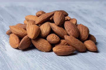 Roasted almond slide on a gray background.