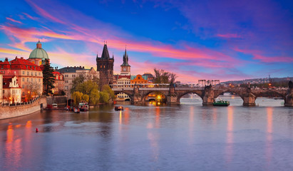 View on Vltava river and Charles bridge in Prague at sunset