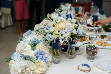 A beautiful stylish bouquet stands on the table close-up