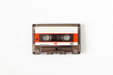 Old tape cassette, old or aged wood background. İsolated casette