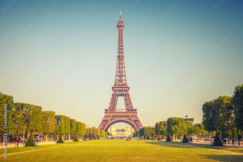 Wall mural eiffel tower over blue sky in paris, france