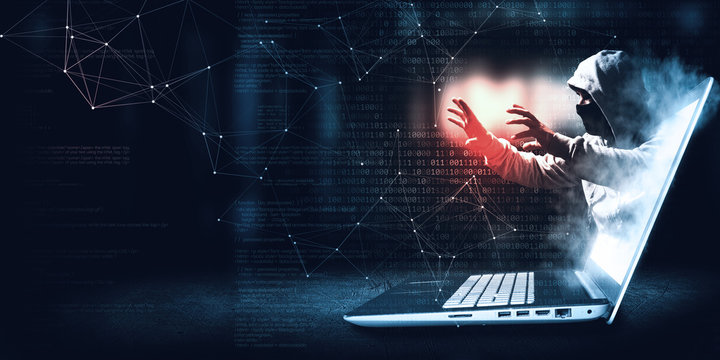 hacker coming out of the screen. steals information.