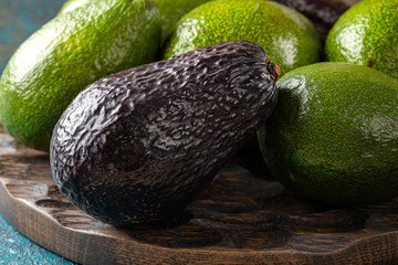 avocado on a dark rustic background on dark board