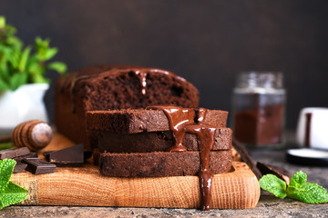 Brownie is a classic American dessert. Chocolate muffin with chocolate sauce and mint.