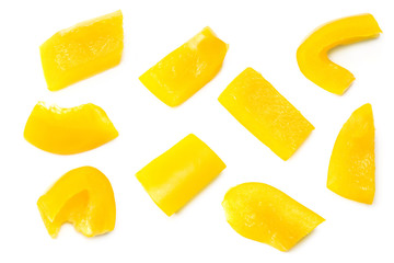 cut slices of yellow sweet bell pepper isolated on white background. top view