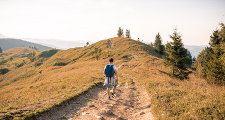 Happy Man traveler with backpack. Travel Lifestyle adventure concept active summer vacations outdoor.