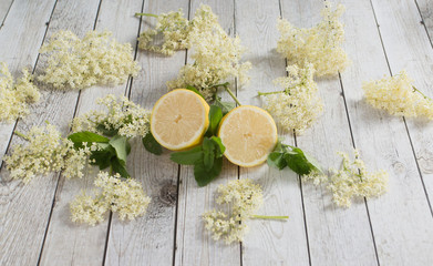 Preaparation for home made Elderberry syrup. Home made with sugar, and lemons. On the wooden...