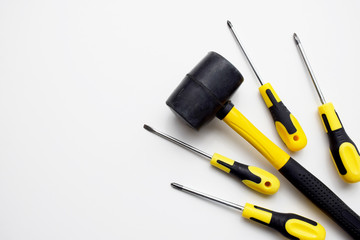 Black and yellow set of building tools, hammer and screwdrivers to repair, build, improve, fix. Building company, repair service