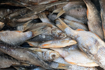tasty beer snack in the form of dried dried fish, background of fish.