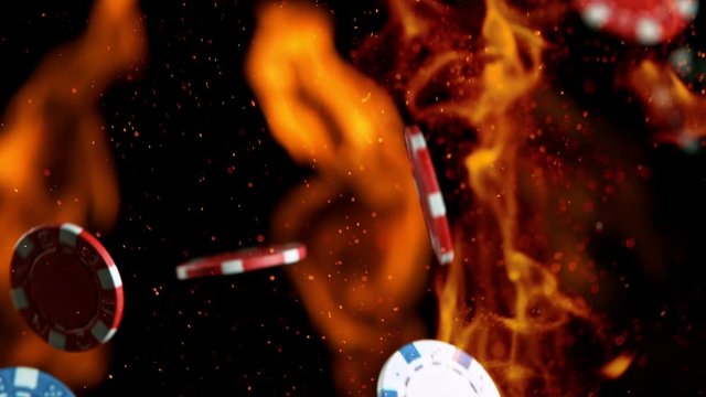 Poker chips falling on casino table in super slow motion, filmed on high speed cinema camera at 1000 fps. Gambling background.