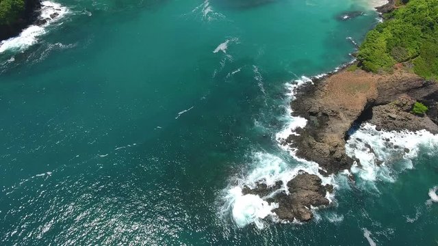 Forward Flying Aerial View of Cavada Islands (Isla Secas) with Coral and Rock Fringed Clear Water Beaches
