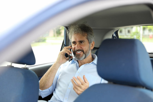 Senior Bearded Gray Haired Businessman Using Smartphone Sitting Back Seat In Car