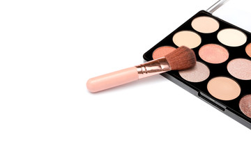 Make-up palette with brushes isolated on white background. top view