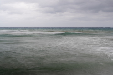 long exposure shot of the caribbean sea on a gray overcast day