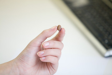 Very small hearing aid in a female hand