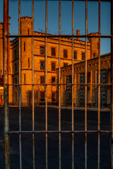 Old prison through jail bars