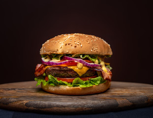 Beef burgers on wooden plate 