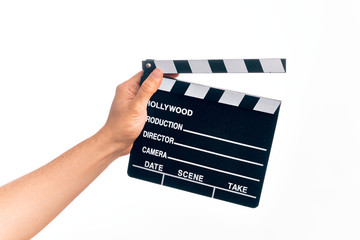 Hand of caucasian young filmmaker man holding clapboard over isolated white background