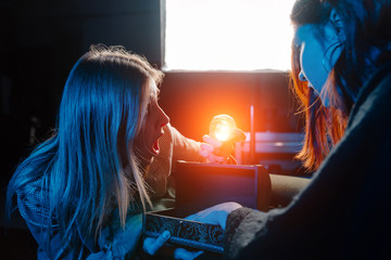 Woman and woman fortune teller with crystal ball