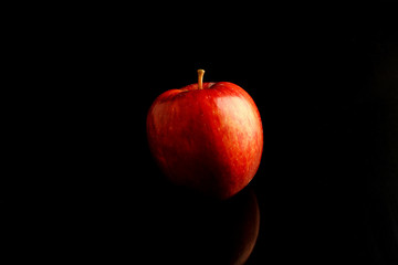 Fototapeta na wymiar red apple healthy fruit on black background