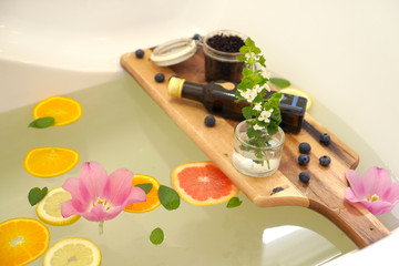 Relaxing bath with fresh fruits and mint.