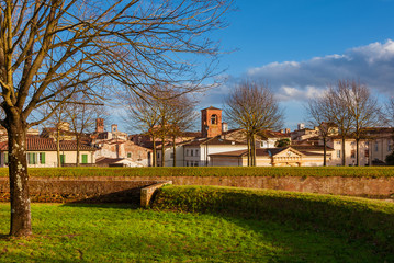 Winter view of Lucca beautiful historic center with medieval towers and belfry from the city ancient walls