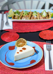 Cheese cake in a blue plate with marmalade