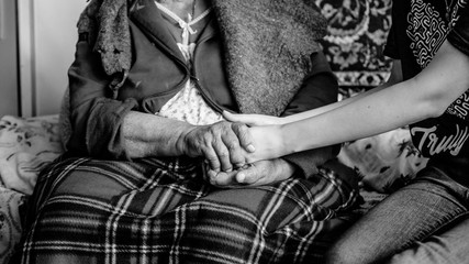 the hands of an old man into the hands of a young one