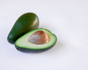 Sliced fresh avocado on a white background.