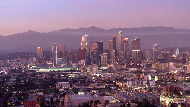 Downtown Los Angeles aerial view, business centre of the city in dawn, sunset in California, mountains in a background of skyscrapers