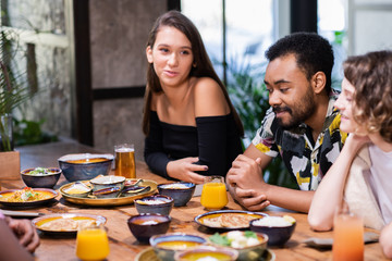 Highschool students having a lunch in a modern cafe