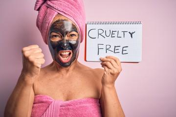 Middle age brunette woman wearing cruelty free beauty black face mask annoyed and frustrated...