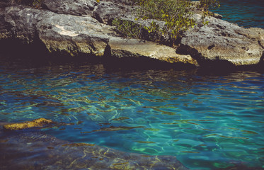Beautiful natural view of transparent waters of turquoise blue Caribbean lagoon Yal-ku located in Mexican Mayan Riviera, Quintana Roo at Akumal