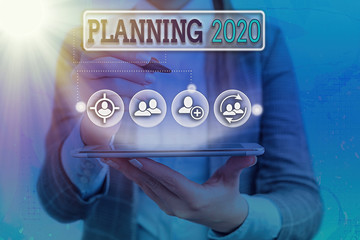 Conceptual hand writing showing Planning 2020. Concept meaning process of making plans for...
