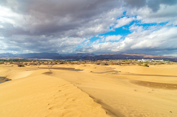 Maspalomas dunes with the center of the island of Gran Canaria in the background