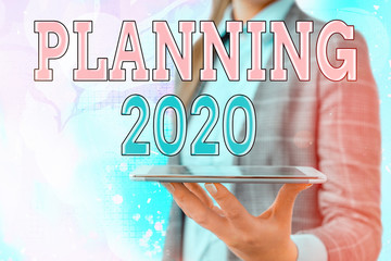 Conceptual hand writing showing Planning 2020. Concept meaning process of making plans for...