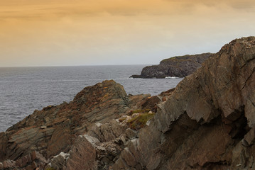 Fototapeta na wymiar Serene morning near the rocks at the beach in Bonavista, Newfoundland, Canada