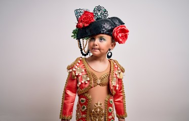 Young little caucasian kid girl wearing  bullfighter traditional folkore spanish suit as carnival...