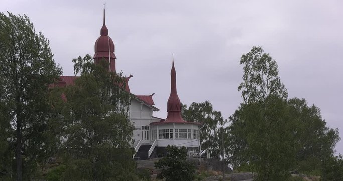 4K Helsinki Baltic Sea Finnish Bay lagoon, yachts, cruise liners view on bright summer day aerial video, Luoto Island green park, old beautiful red roof mansion in Finland capital Suomi, north Europe