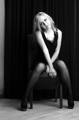 Fashion photo of young lady in elegant black dress