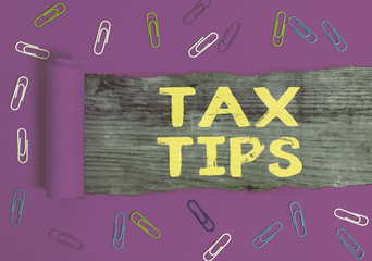 Text sign showing Tax Tips. Business photo text compulsory contribution to state revenue levied by...