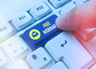 Writing note showing Free Webinar. Business concept for Lecture Workshop Seminar that is...