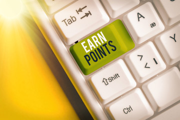 Writing note showing Earn Points. Business concept for collecting scores in order qualify to win...