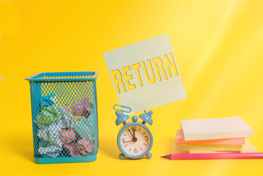 Writing note showing Return. Business concept for come or go back to a place or an individual Give money you took before Alarm clock pencil note paper balls container pads colored background - Powered by Adobe
