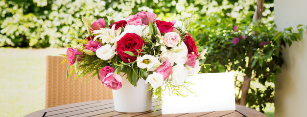 Bunch of flowers in reusable vase. Holiday, celebration, romance, online order and contactless delivery concept. Place for text on wide screen banner format