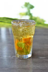 Refreshing peach and mint ice tea served outdoors