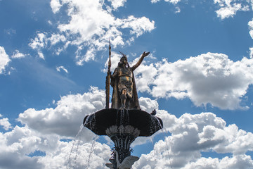 bronze indigenous statue monument in the sky of Cusco, Peru