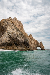 Fototapeta na wymiar The arch of Cabo San Lucas, is a distinctive rock formation at the southern tip of Cabo San Lucas, which is itself the extreme southern end of Mexico's Baja California Peninsula