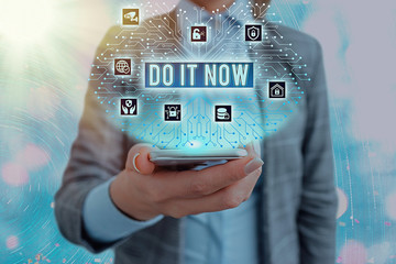 Conceptual hand writing showing Do It Now. Concept meaning not hesitate and start working or doing...