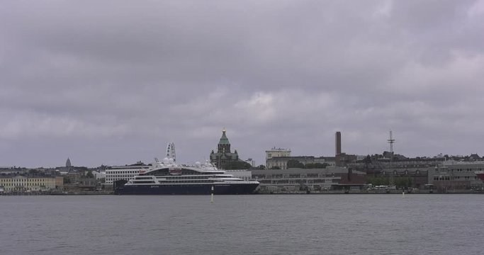 4K Helsinki Baltic Sea Finnish Bay lagoon, yachts, cruise liners view on bright summer day aerial video, Luoto Island green park, old beautiful red roof mansion in Finland capital Suomi, north Europe